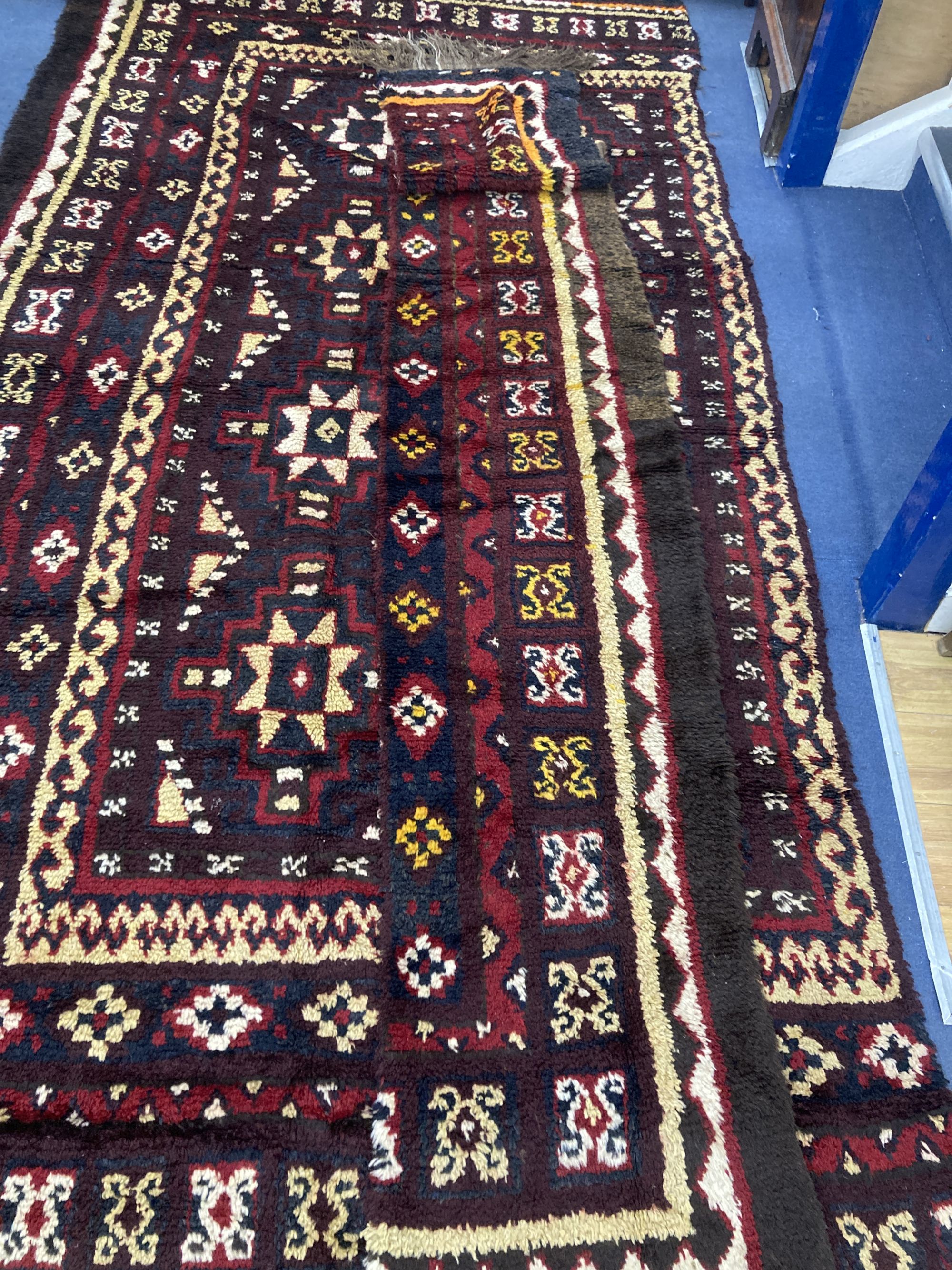 A central Asian wool carpet, 350 x 220cm (in two sections)